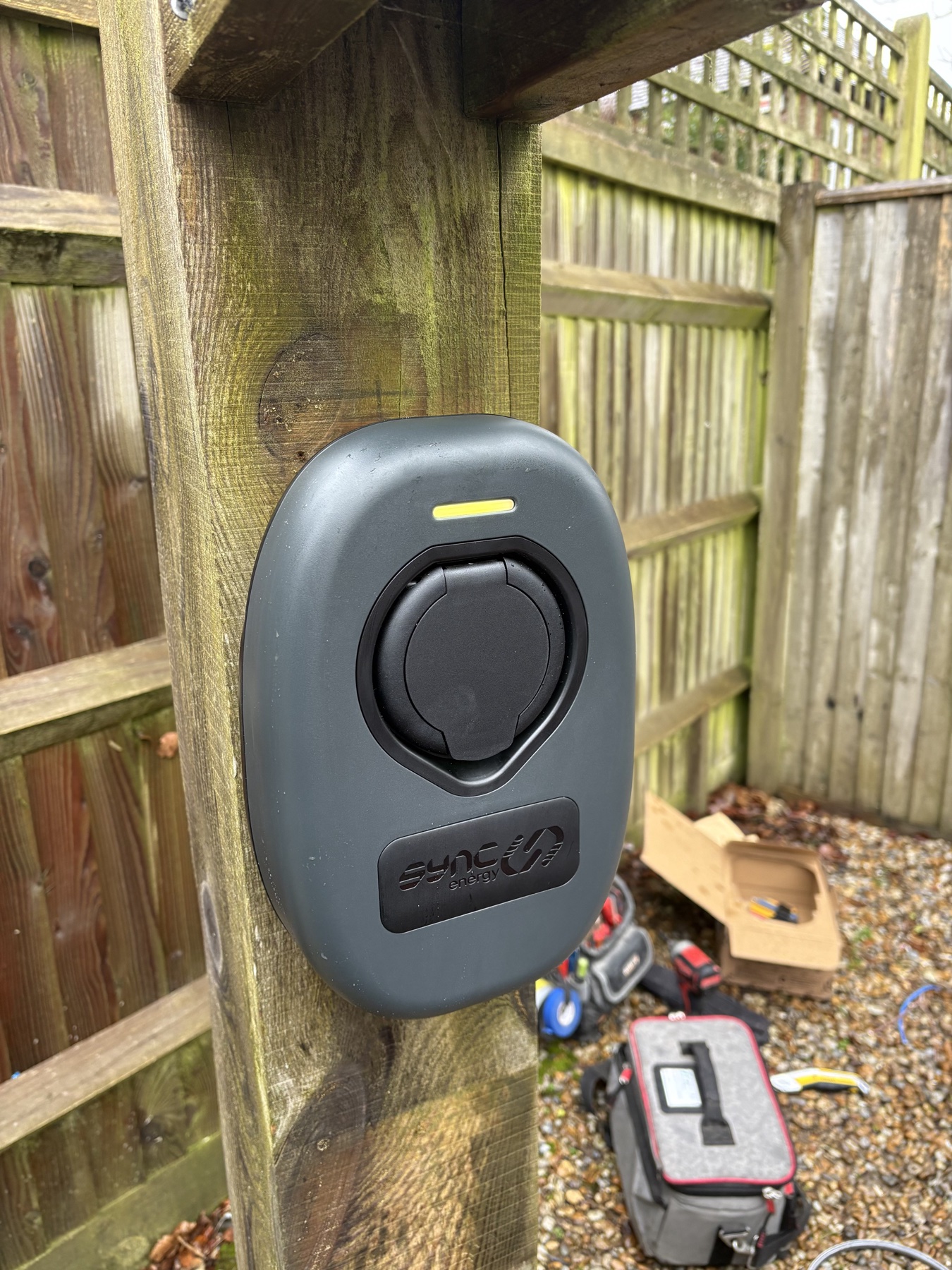 Outdoor electric vehicle charge point mounted on a timber post